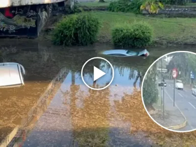 Cámara registra autos cayendo en paso a nivel inundado en Ñuñoa.